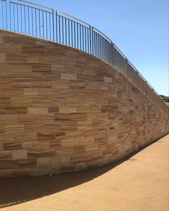 Project: NSW Golf Course Pro shop Upgrade 
Location: La Perouse NSW
Products: 65mm Split faced cladding, 50mm Rockfaced Capping, Custom Profiled Lintels and sils.
Colour: Dixons Banded
Builder: East Coast Stone